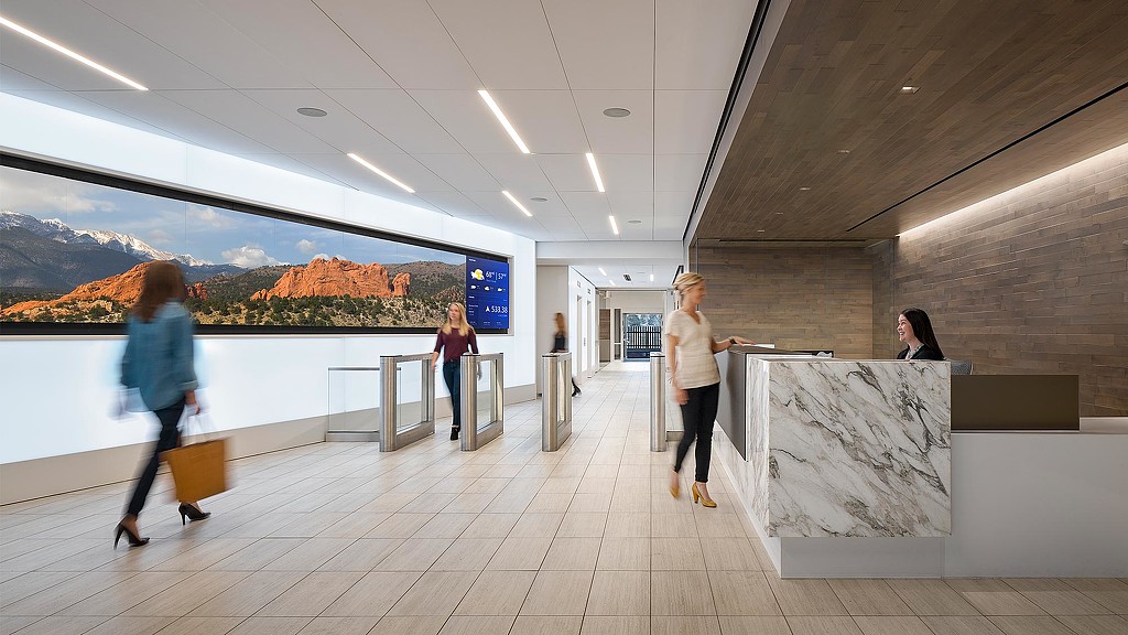 A group of people walking in a building.