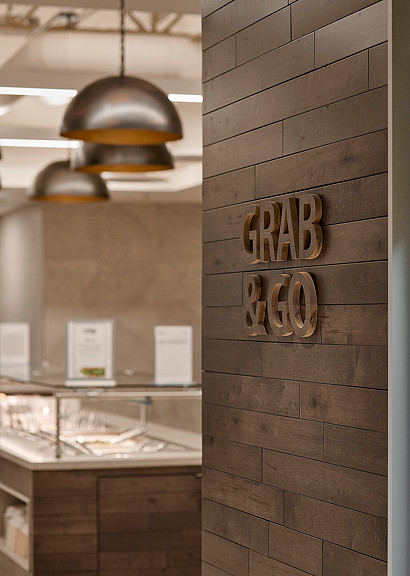 A wood cabinet with a light above it.