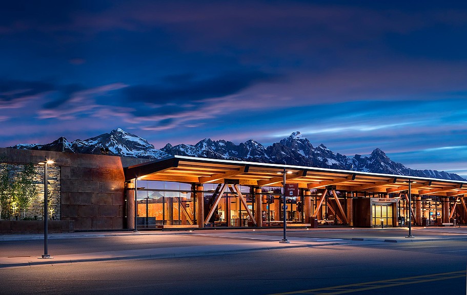 A building with a mountain in the background.