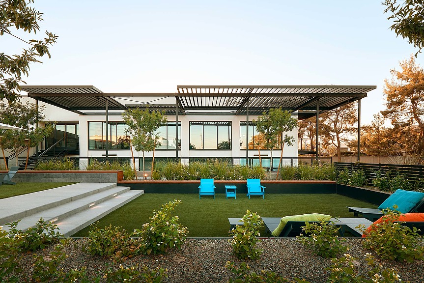 A building with a swimming pool.