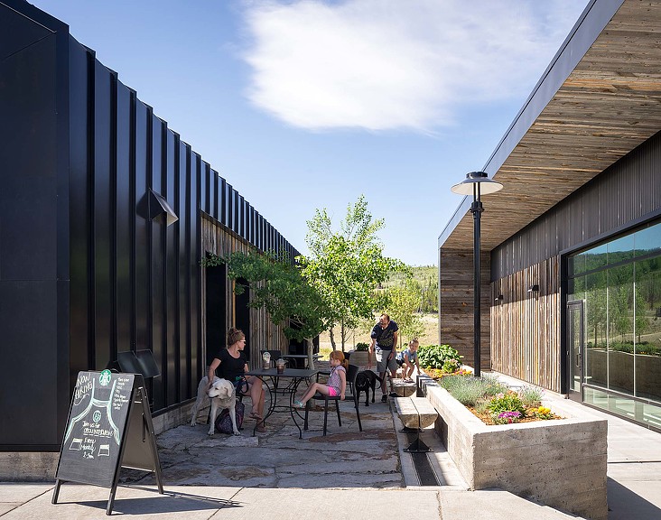 People sitting outside a building.