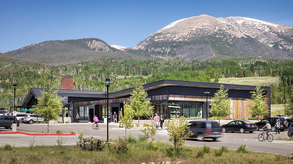 A building with a mountain in the background.