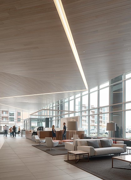 A large room with a large glass ceiling and a couple people.