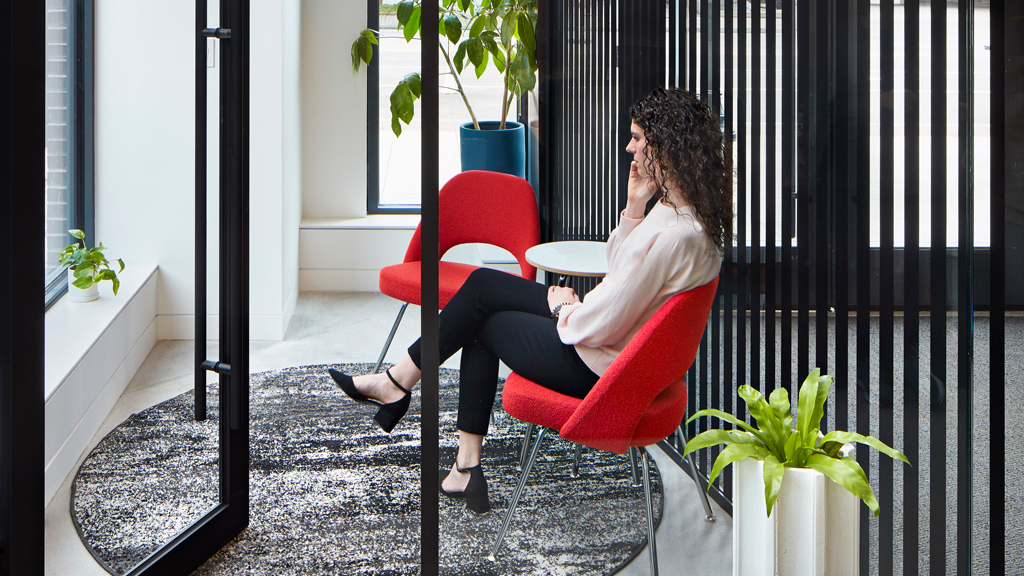 A woman sitting in a chair.