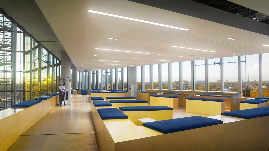 A large room with blue couches.