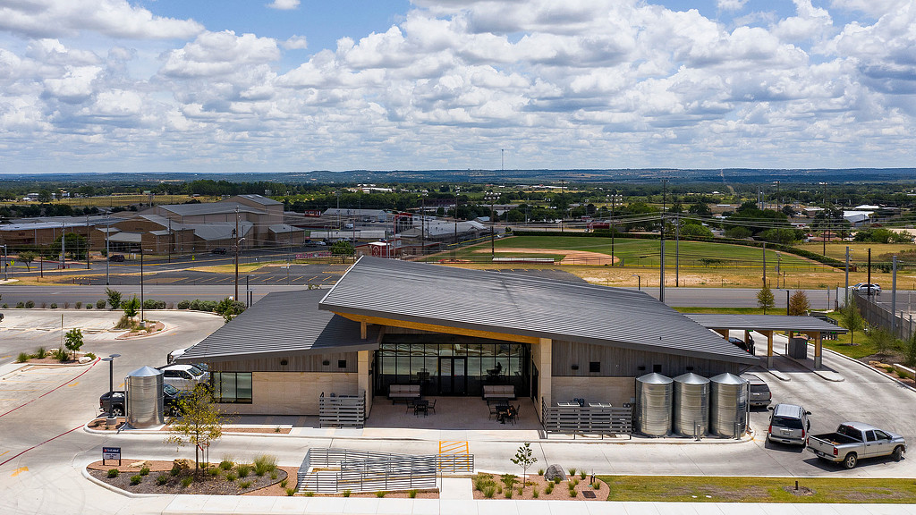 A building with a parking lot.