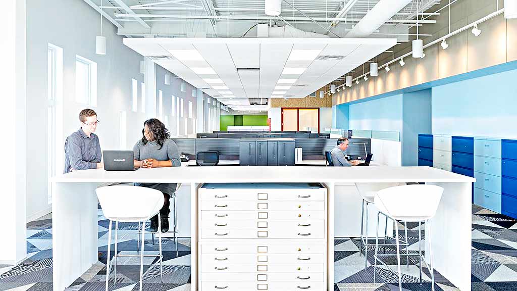 A few people working in an office.