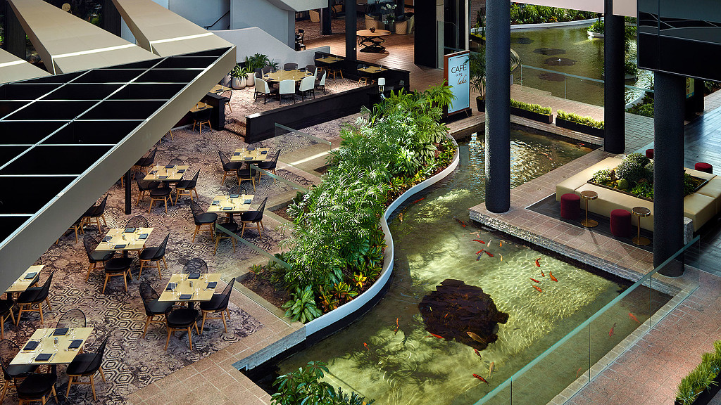 A courtyard with tables and chairs.