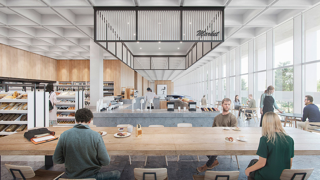 People sitting at tables in a room.