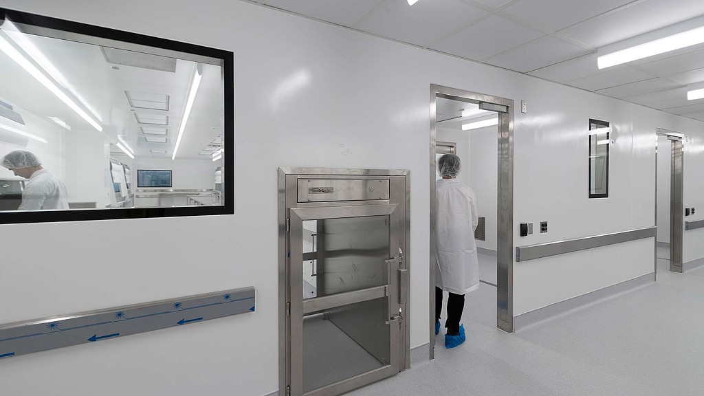 A person in a white coat.