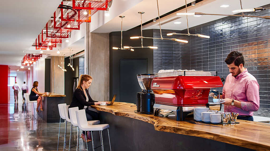 A woman and a man in a restaurant.