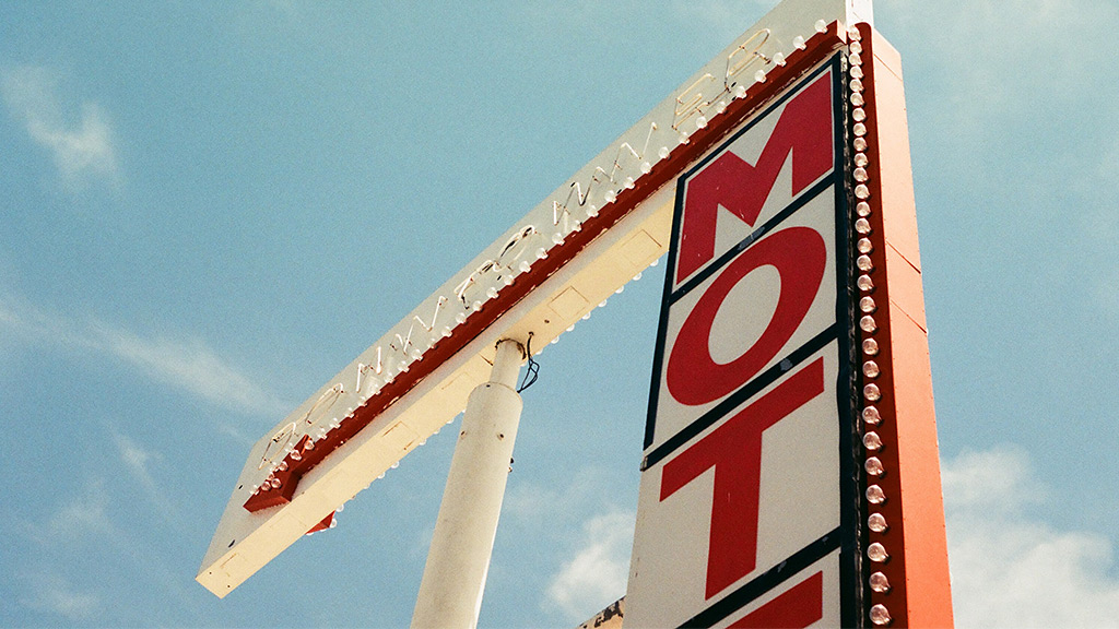 A sign with a red and white sign.