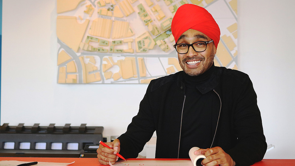 A man wearing a red hat and glasses.