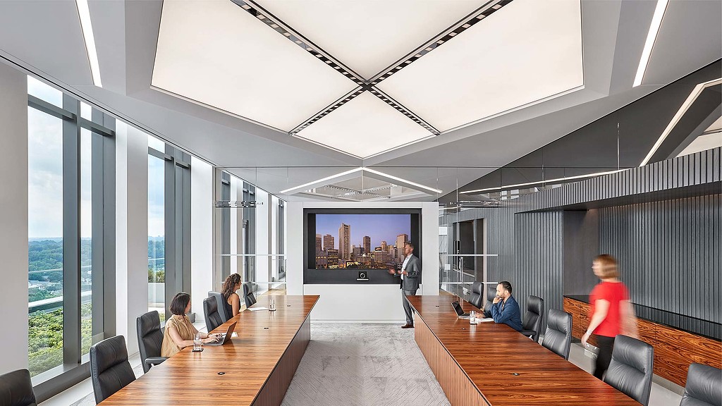 A group of people in a conference room.