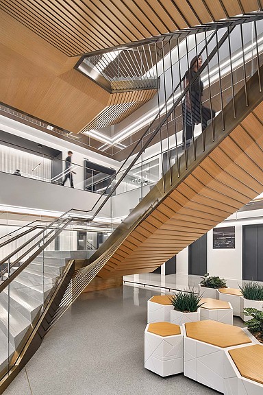 A building with a staircase and tables.