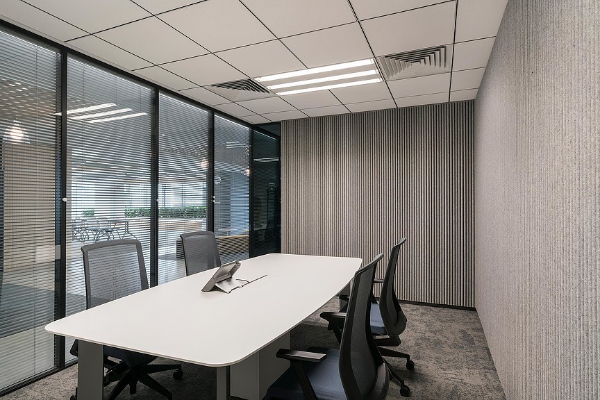 A conference room with a large table.