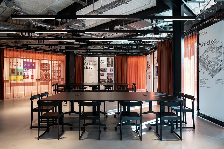 A room with a table and chairs.