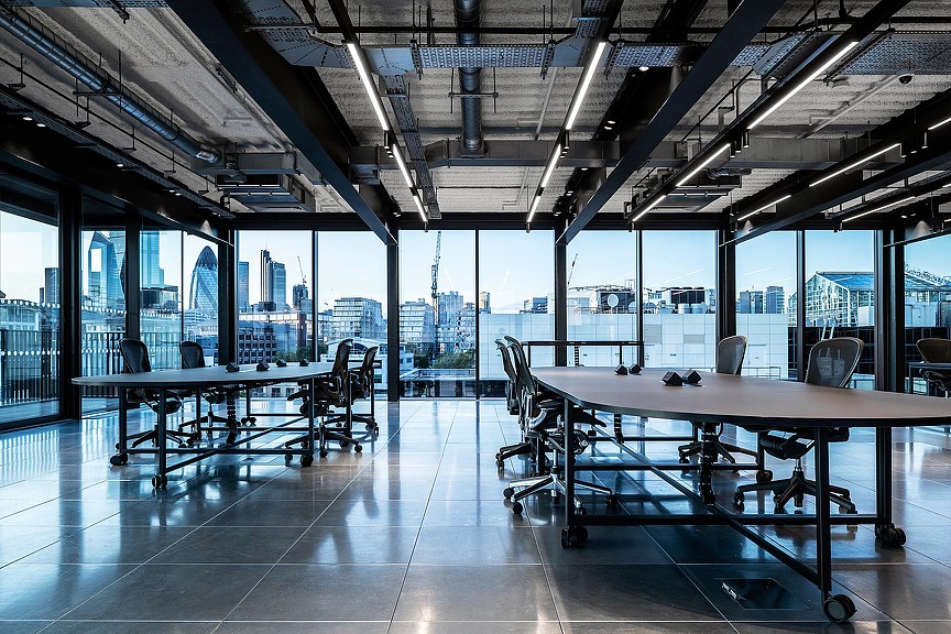A room with tables and chairs.