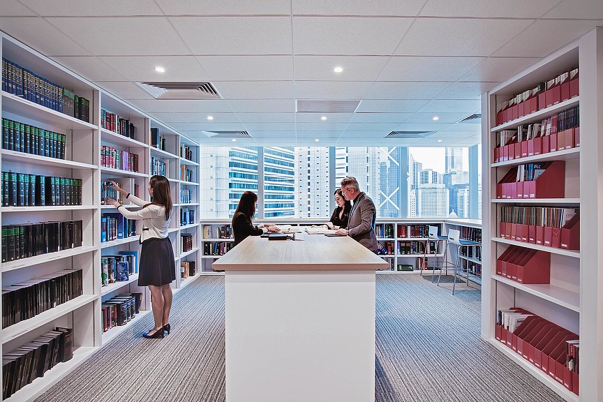 A man and woman in a library.