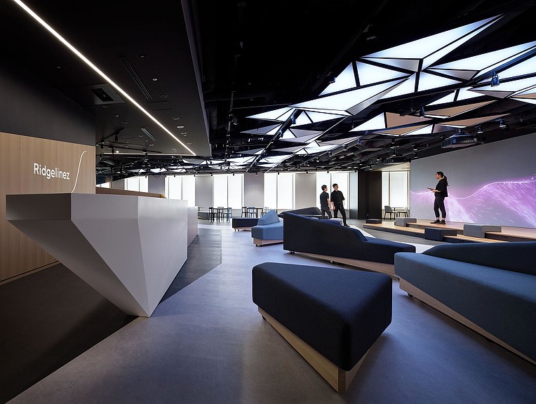 A room with couches and people.