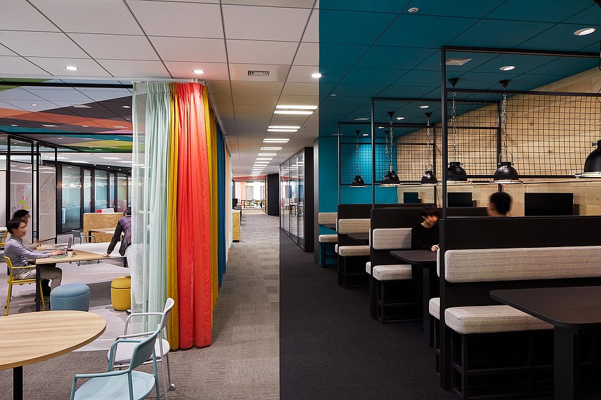 A room with tables and chairs.