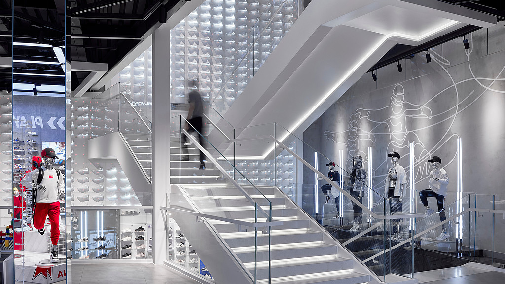 A group of people walking up a staircase.