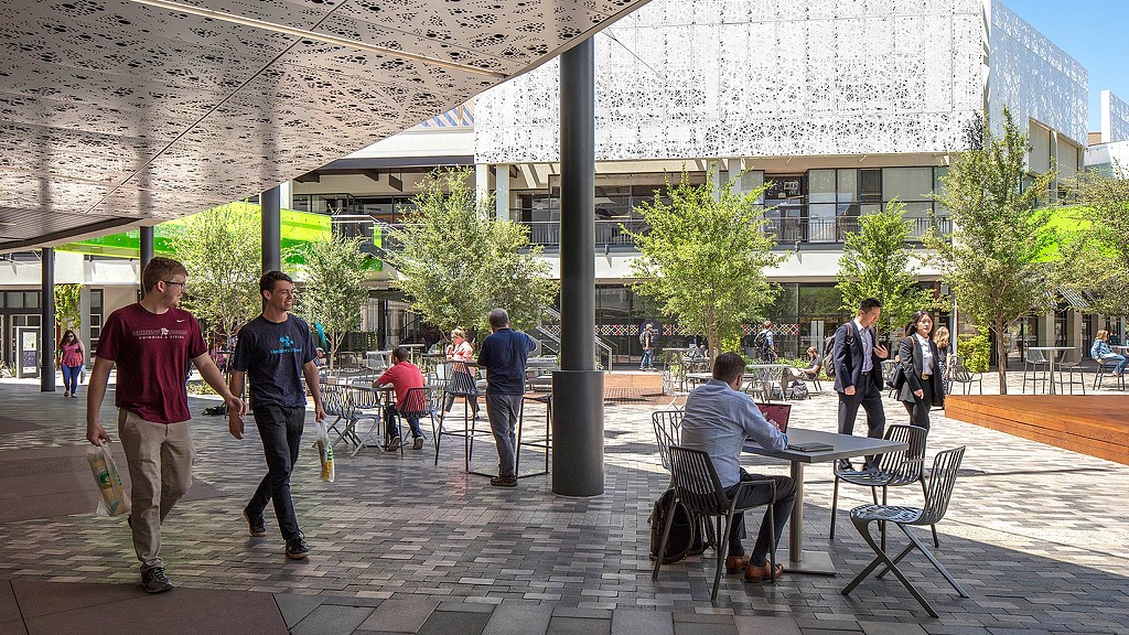 A group of people outside a building.