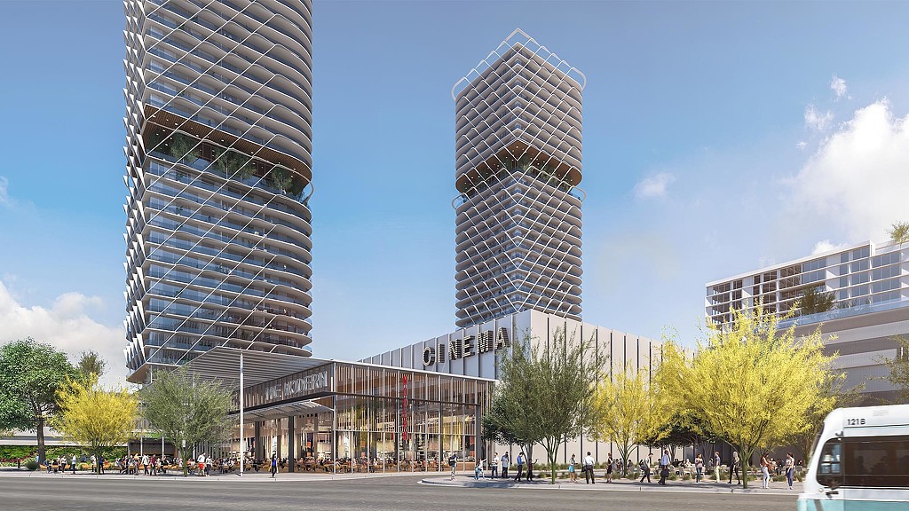 A group of buildings with trees in front of them.