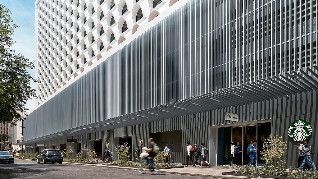 A building with people walking around.