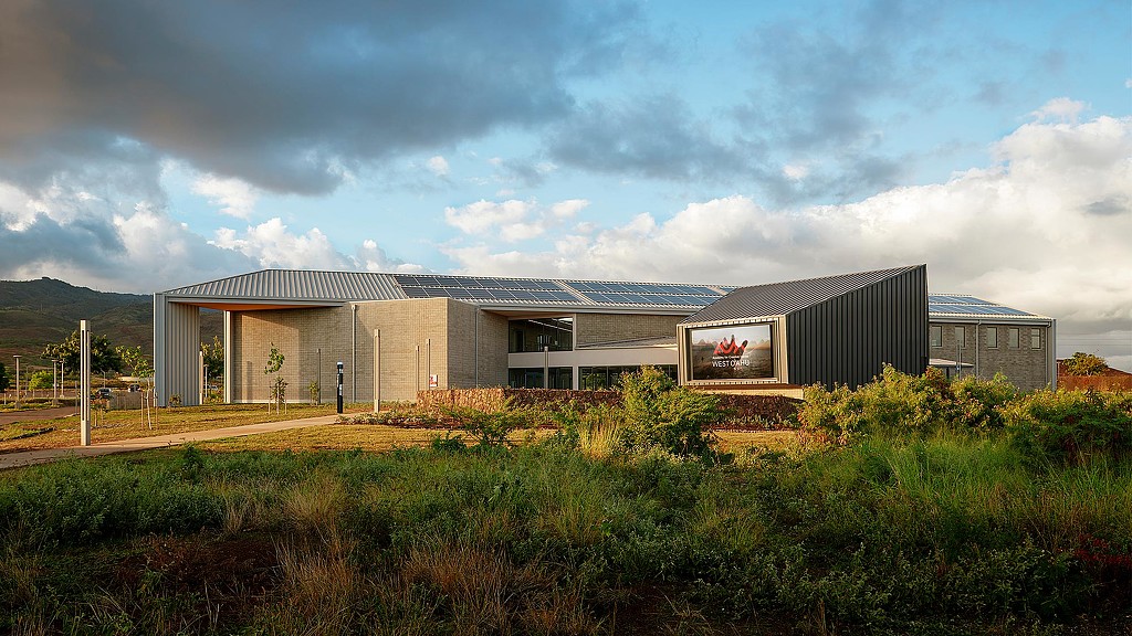 A building with a sign in front of it.