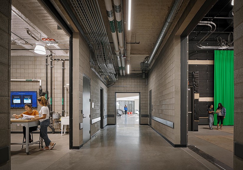 People sitting at tables in a building.