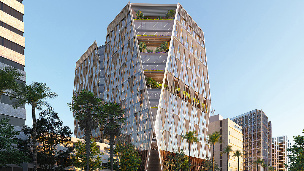 A tall building with trees in front of it.