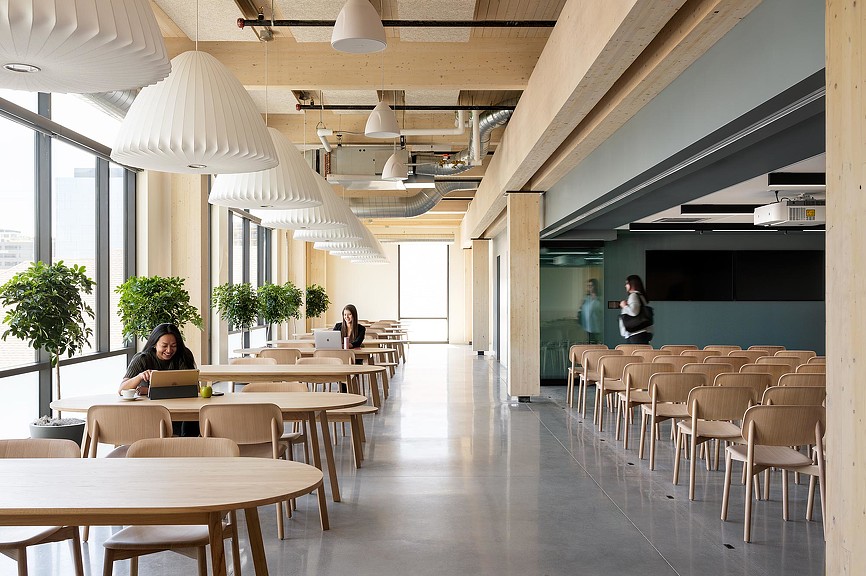 A group of people sitting at tables.