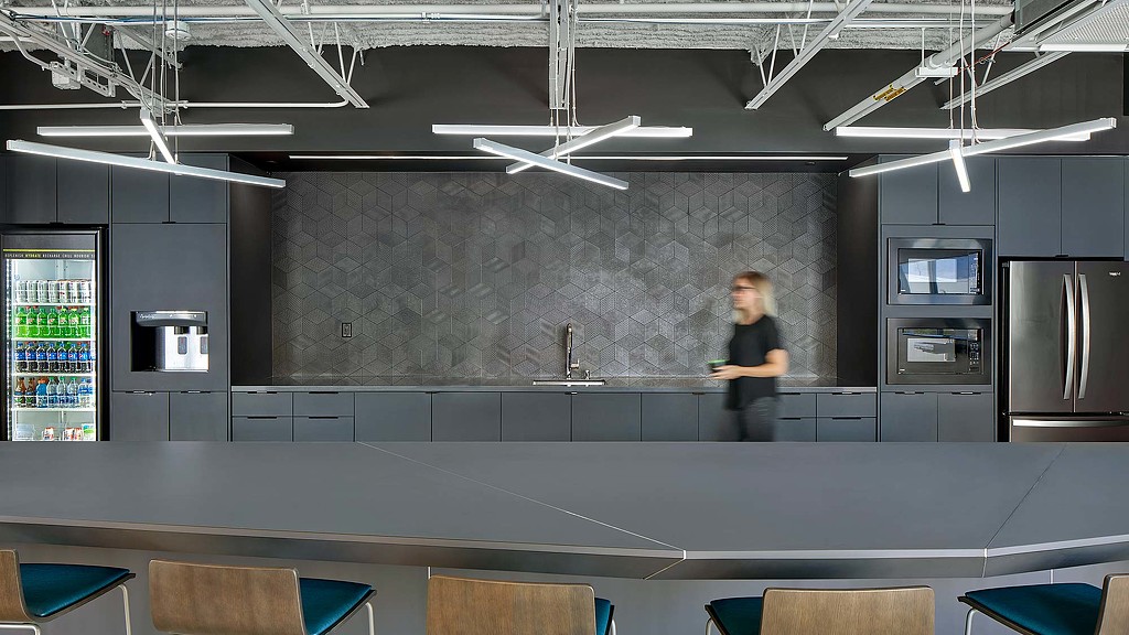 A person standing in a kitchen.