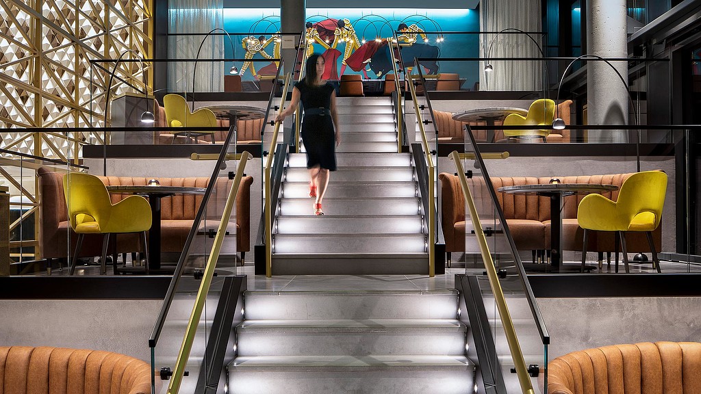 A person walking up a flight of stairs.