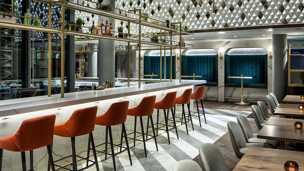 A room with tables and chairs.