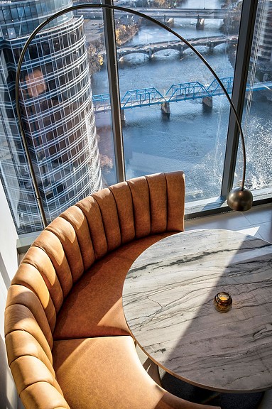 A chair in front of a window.