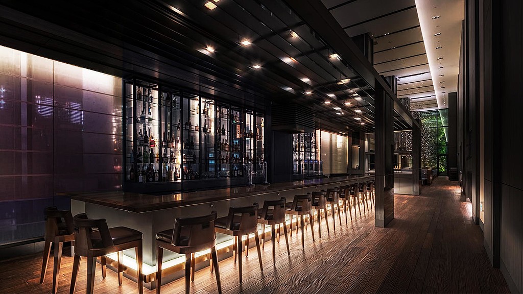 A room with a table and chairs.