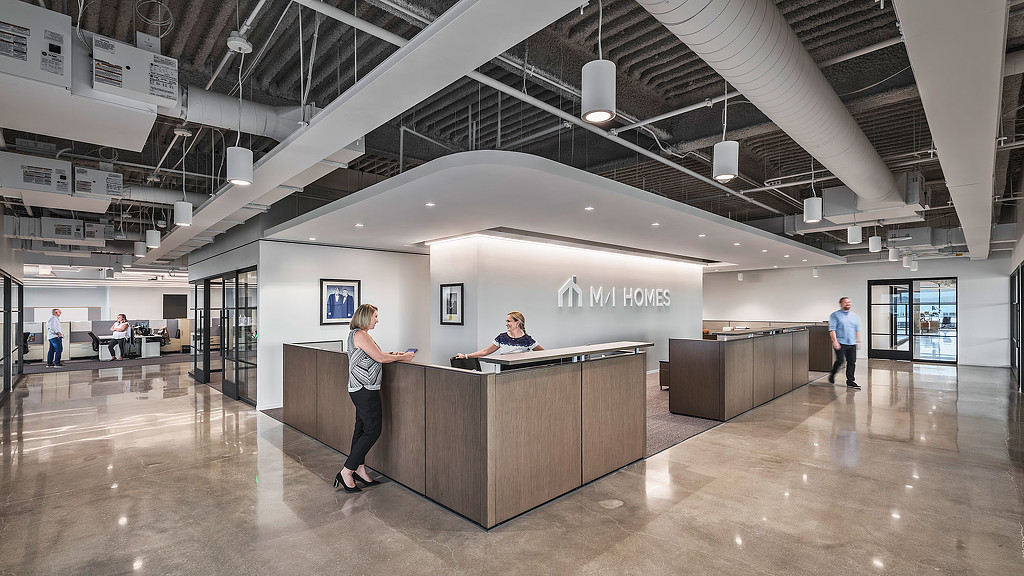 A person standing at a counter.
