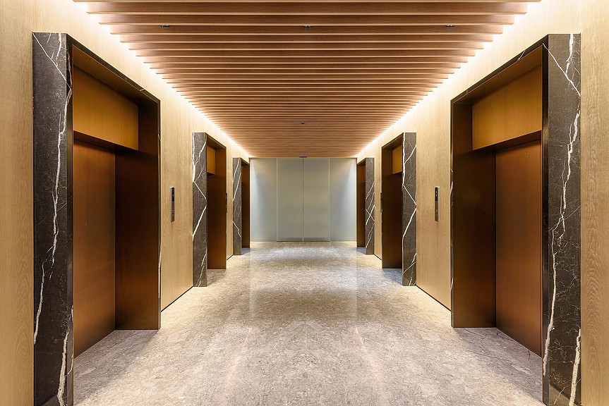 A long hallway with doors.