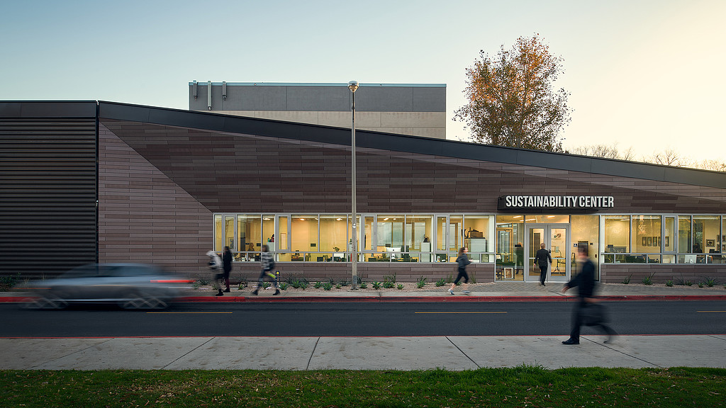 A building with people walking out front.