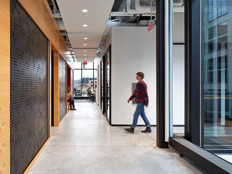 A person walking in a hallway.