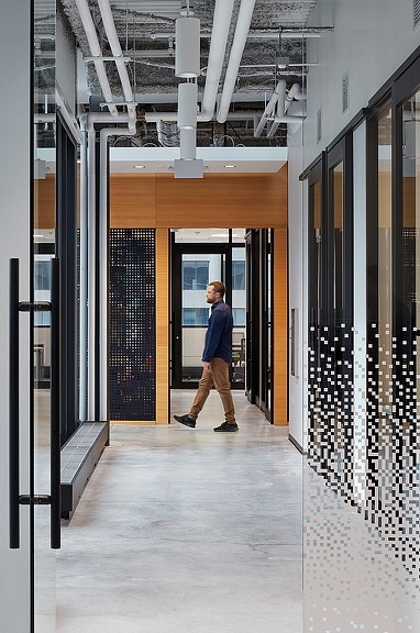 A person walking through a hallway.