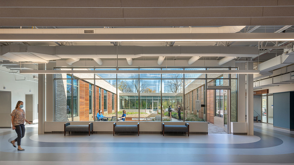 A person walking in a large room.