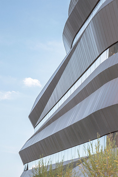 A tall building with a blue sky.