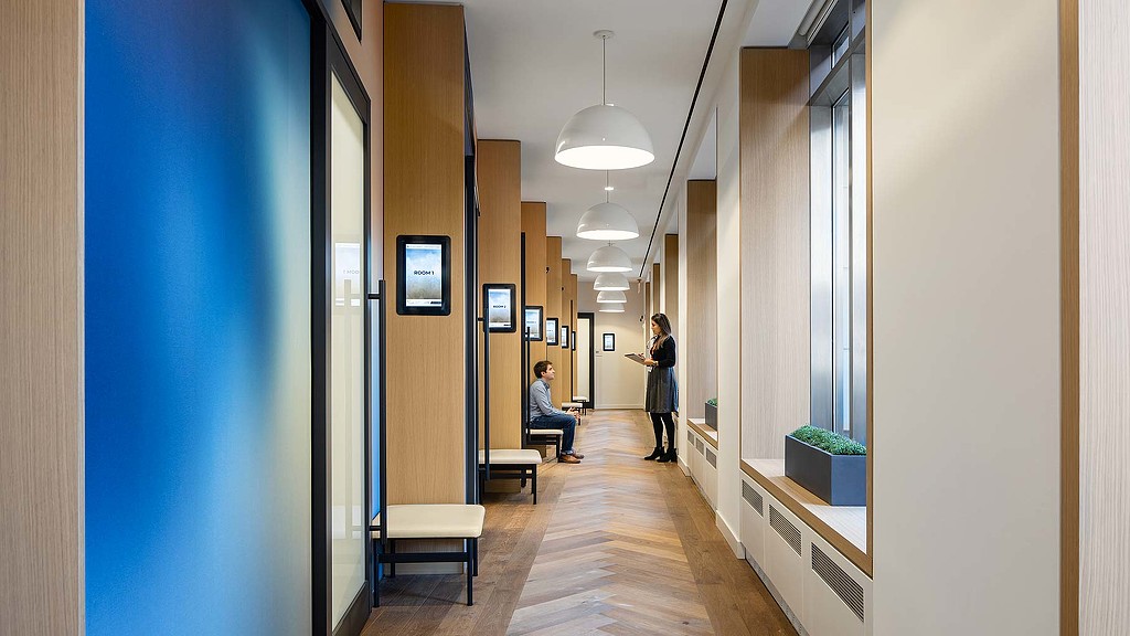 A person standing in a hallway.