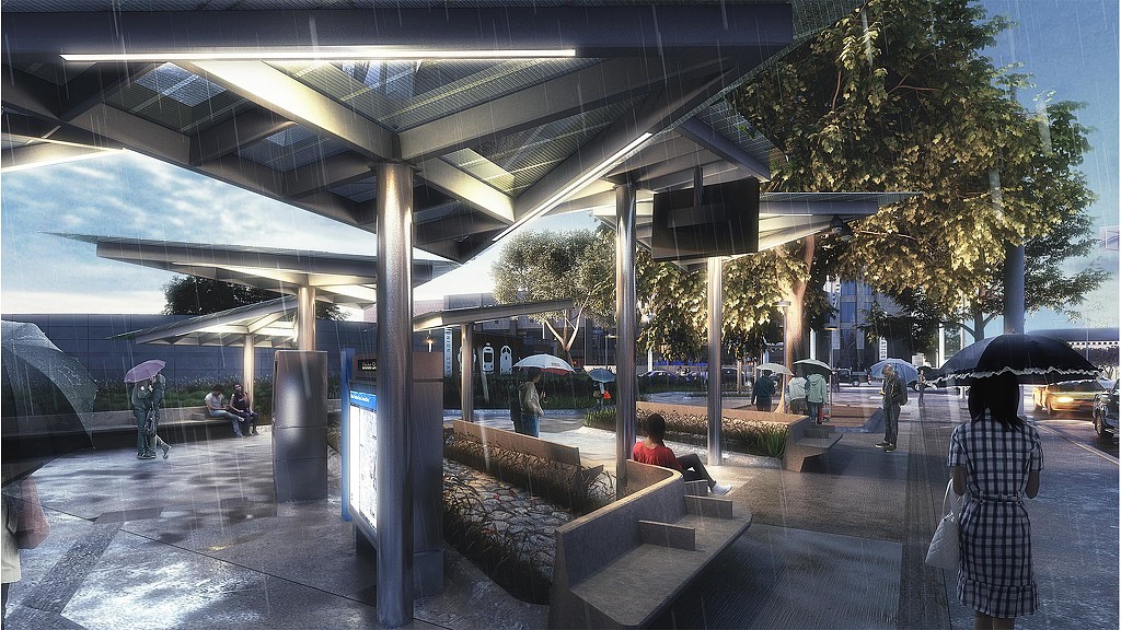 A group of people walking under a covered area.