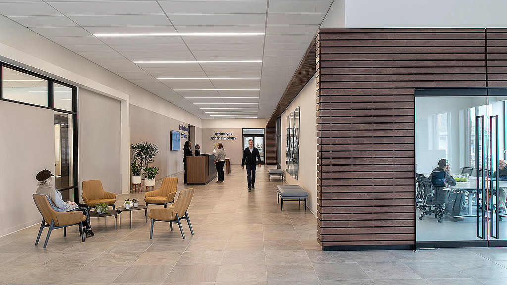 A group of people walking through a building.