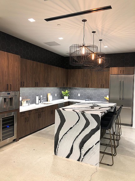 A kitchen with a chandelier.