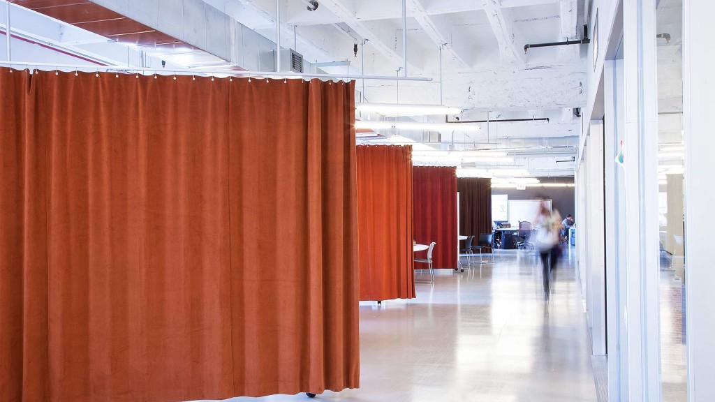 A long hallway with a few people.